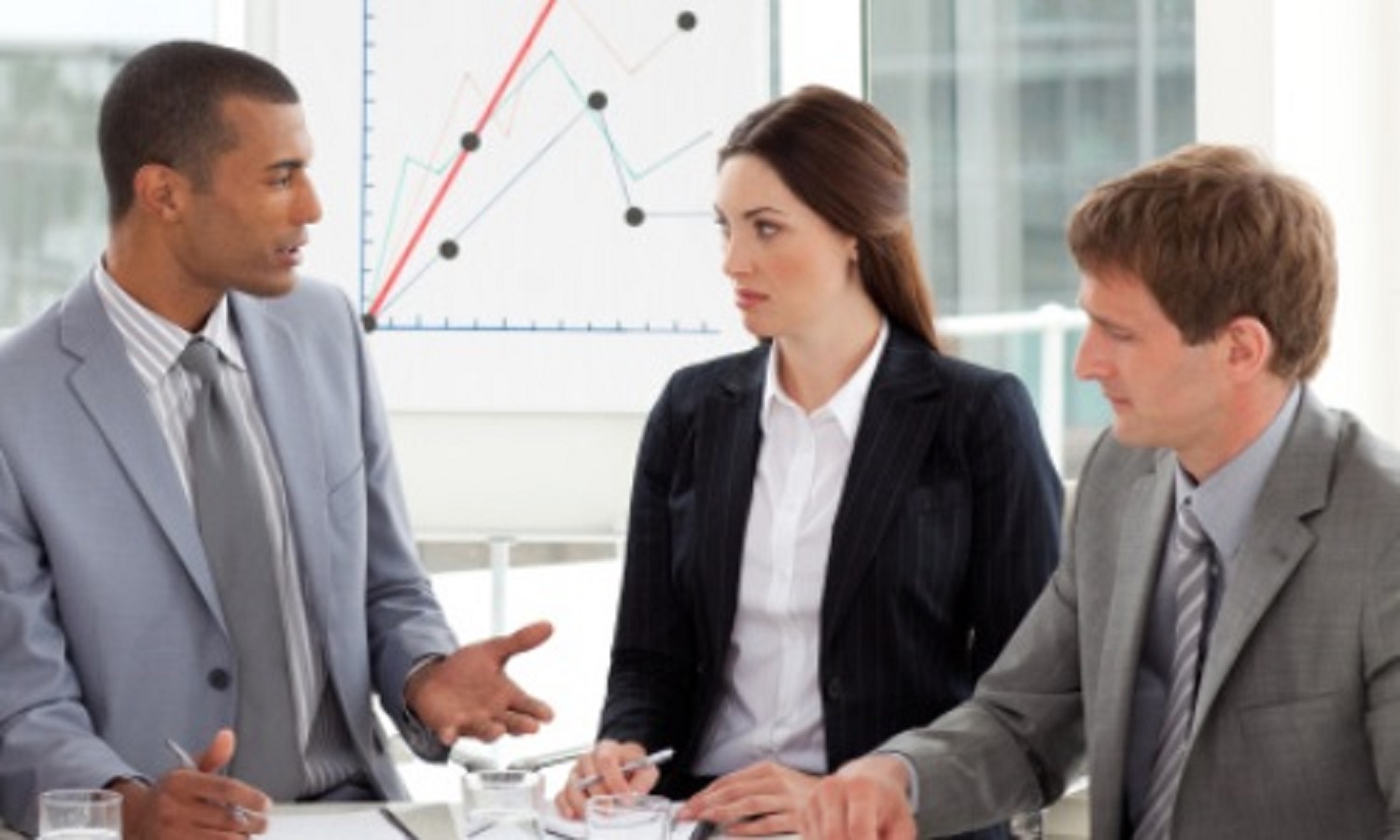 Serious co-workers studying a new business plan